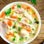 7-Ingredient, amazingly easy crockpot chicken and rice soup! With slow cooker, stovetop, pressure cooker, & freezer friendly directions! I hope this recipe helps you for a quick, budget-friendly dinner idea. Enjoy! | SlowCookerKitchen.com