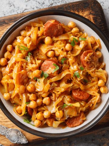 Cabbage soup with smoked sausage, chickpeas and tender cabbage