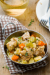 Crockpot chicken fricassee with tender chicken thighs, potatoes, carrots and celery