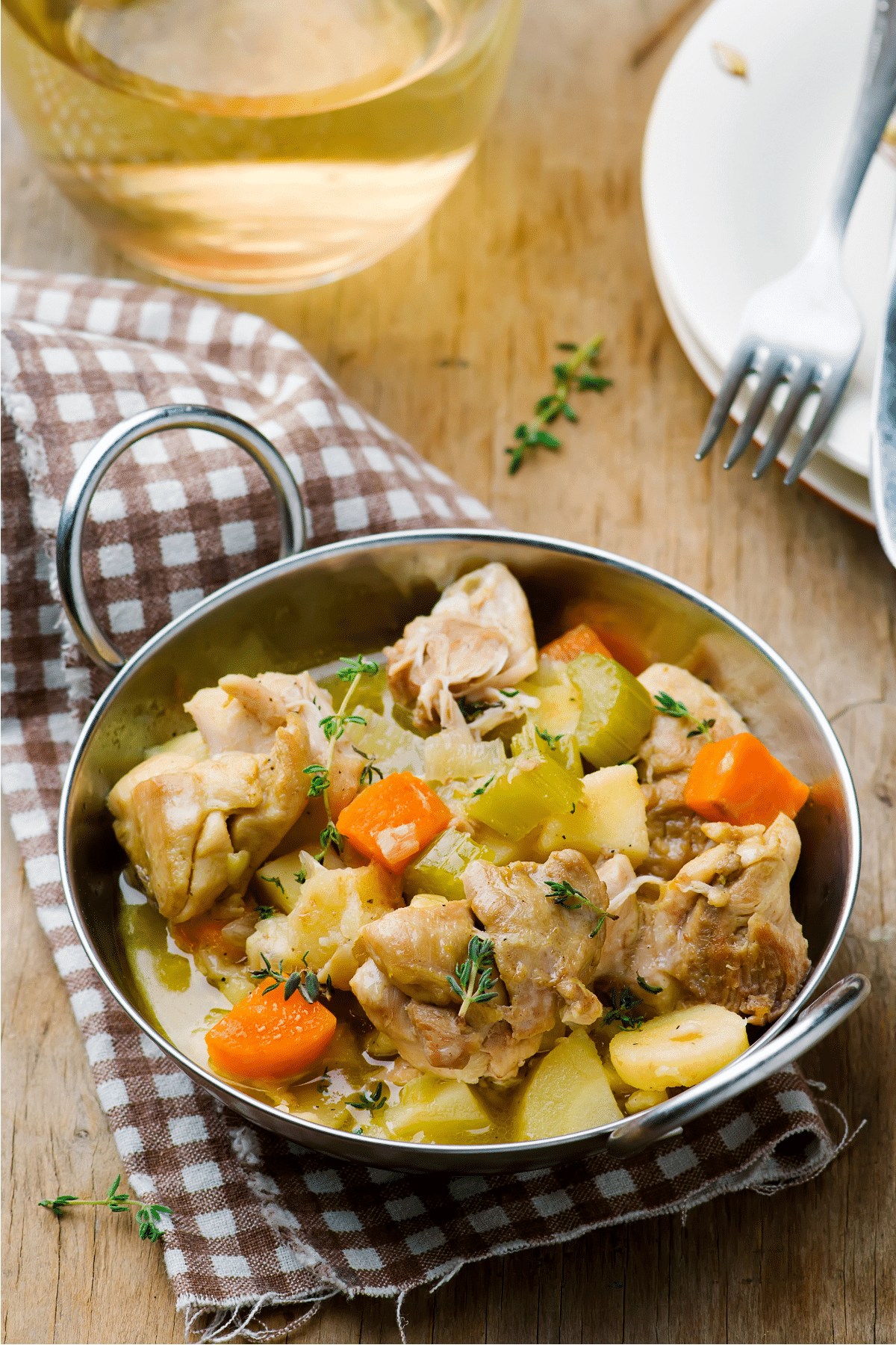 Crockpot chicken fricassee with tender chicken thighs, potatoes, carrots and celery