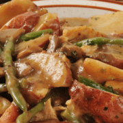 Slow cooker chicken and potatoes with green beans and mushrooms in gravy