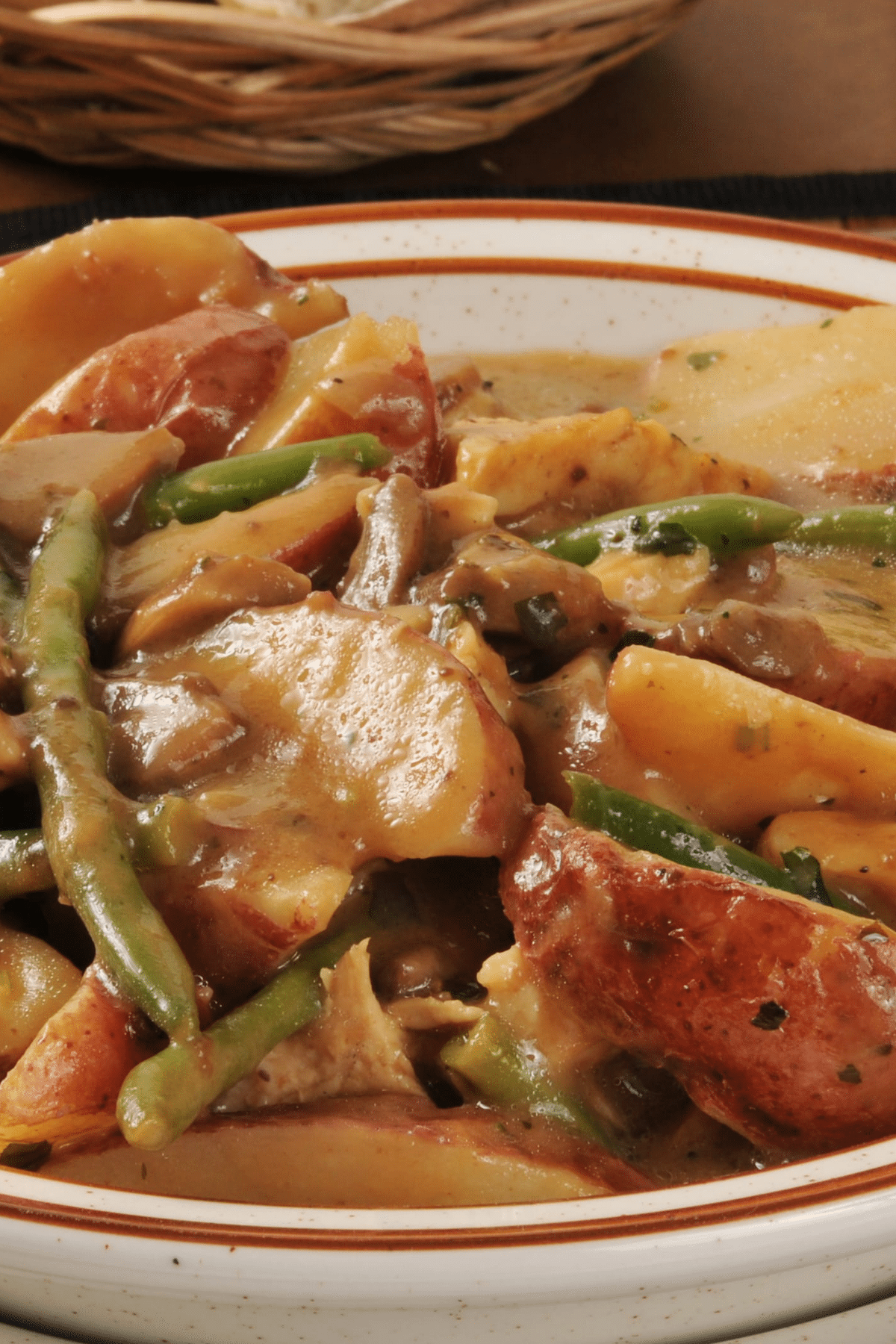 Slow cooker chicken and potatoes with green beans and mushrooms in gravy