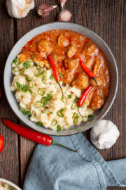 A bowl of creamy pork stew with tender pork in a rich, savory sauce.