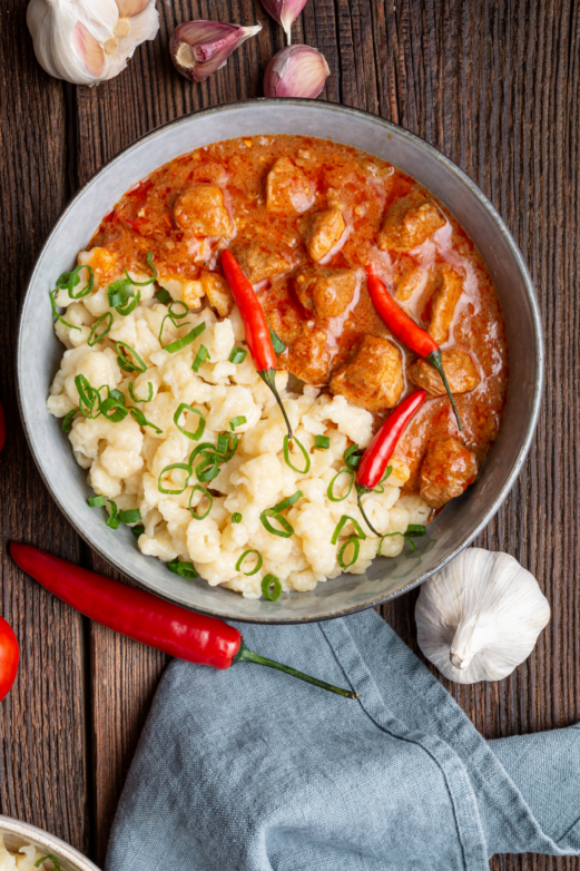 A bowl of creamy pork stew with tender pork in a rich, savory sauce.