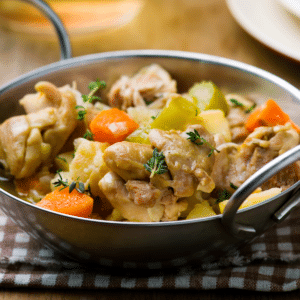 Slow cooker chicken fricassee with chicken, potatoes, carrots and celery